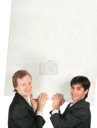 Two businessmen carry white plate foam plastic