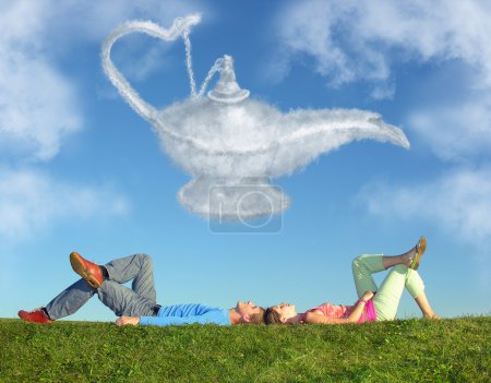 Lying couple on grass and dream alladin lamp cloud collage