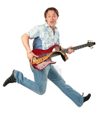 Young man with guitar jumping