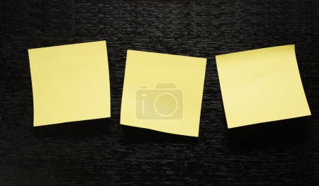 Three sheet of paper on black background