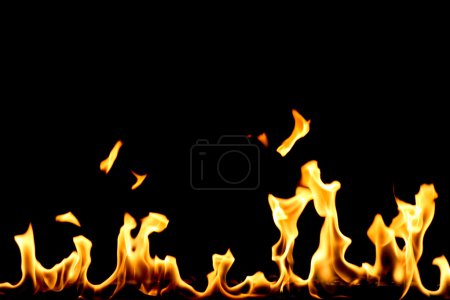 Yellow fire with flame tongues isolated on black