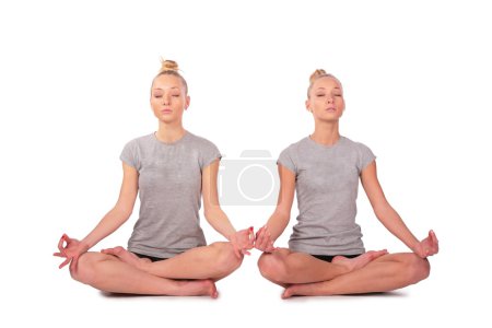 Twin sport girls meditating