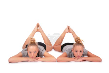 Twin sport girls lying on floor