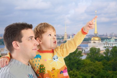 Father with son on historic centre of St.Petersburg background c