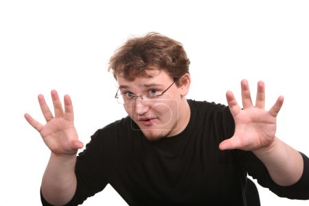 Young man shows gestures by the hands