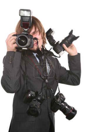 Young man with four cameras