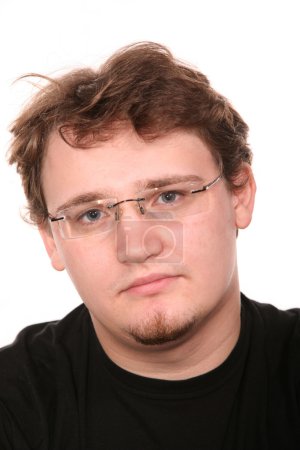 Portrait of young man in glasses