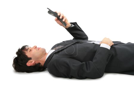 Lying on back businessman with phone