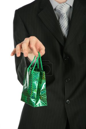 Businessman with gift packet in hand
