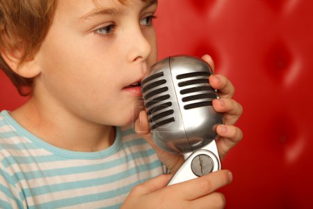 Portrait of boy with microphone