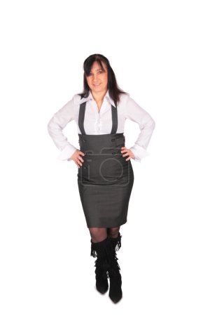 Middleaged Woman in overalls posing