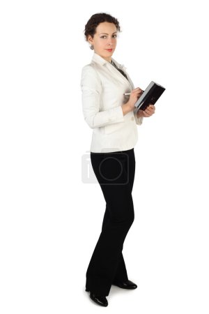 Young beauty brunette woman in business dress, standing and hold