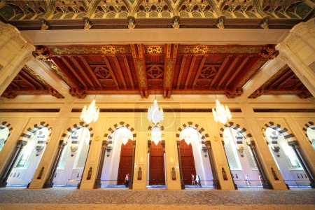 Grand mosque in Oman luxury interior with arches and chandeliers