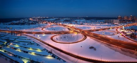 Night winter cityscape with big interchange