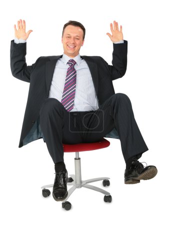 Laughing businessman on office chair
