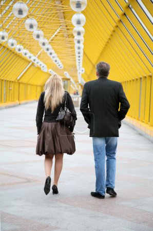 Couple on pedestrian bridge