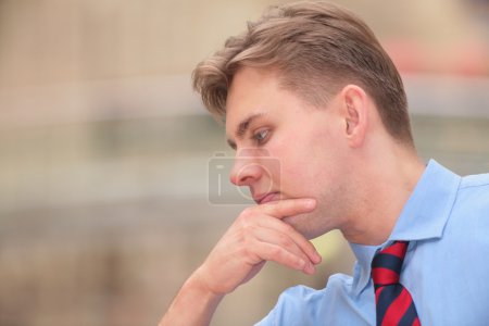 Young thinking businessman