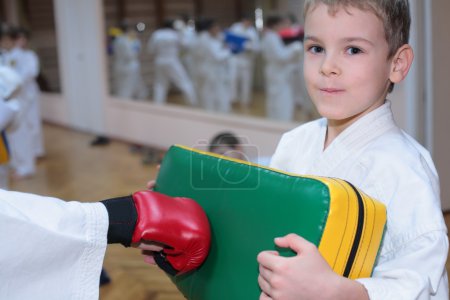 Boy trains in sports hall