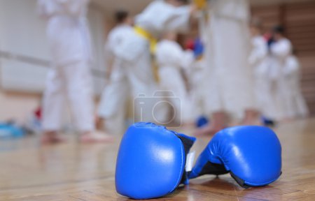 Boxing gloves on floor of sport hall