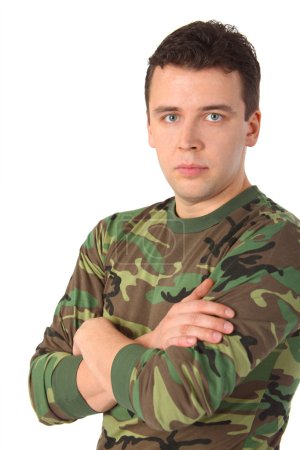 Man in camouflage with crossed hands