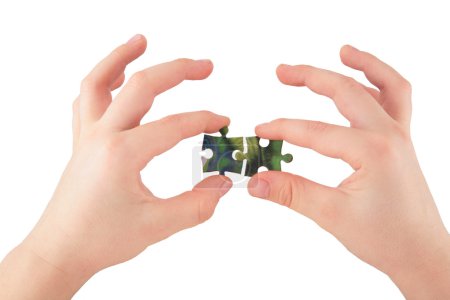 Two hands with puzzle