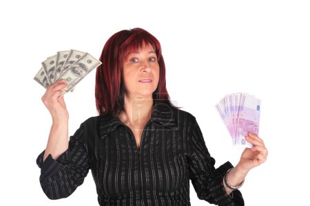 Woman holds dollars and euro