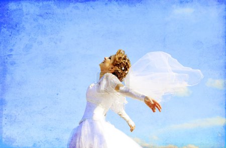 Young bride at blue sky background