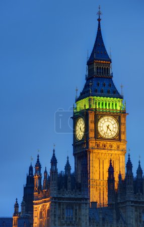 Big Ben at twilight witth lights making architecture glow in the coming dar