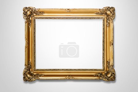 Grunge gold wooden frame on the white wall