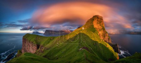 Panorama of Kalsoy island and Kallur lighthouse in sunset light, Faroe Islands