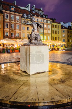 Monument to mermaid at night in Warsaw, Poland