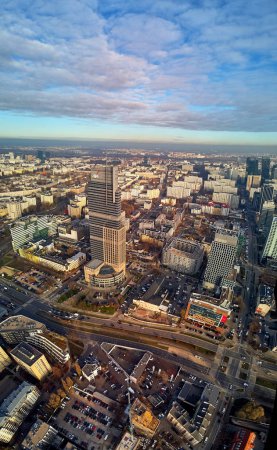 WARSAW, POLAND - NOVEMBER 27, 2018: Beautiful panoramic aerial drone view to the center of Warsaw City and The Warsaw Trade Tower (WTT) - skyscraper along with the Palace of Culture and Science