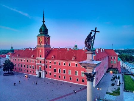 Beautiful panoramic aerial drone view on Warsaw Old town (Stare Miasto) - the oldest district of Warsaw (13th century), Royal Castle, square and the Column of Sigismund III Vasa at sunset, Poland