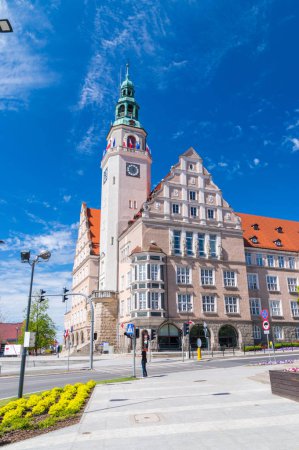 Olsztyn, Poland - May 1, 2018: The New City Hall of Olsztyn with Polish and UE flags on the tower.