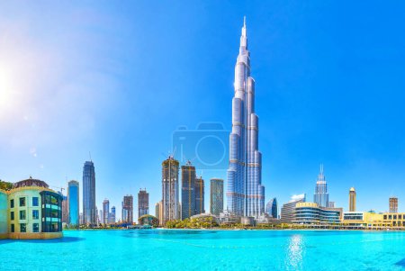 DUBAI, UAE - MARCH 3, 2020: The amazing panorama of the Burj Khalifa tower and its surrounding skyscrapers with large lake on foreground, on March 3 in Dubai