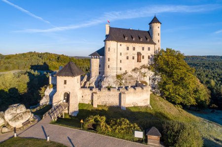 Medieval Castle in Bobolice, Poland, built in 14th century, renovated in 20th century. One of strongholds called Eagles Nests in Polish Jurassic Highland in Silesia. Aerial view in sunrise light