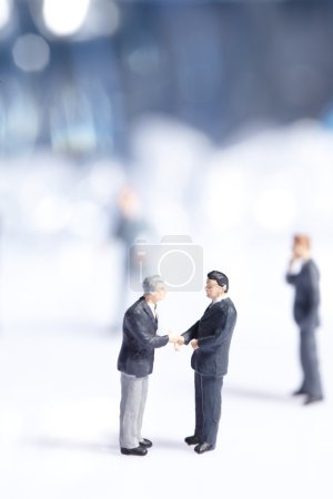 Business figurines standing