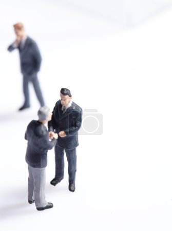 Business figurines standing