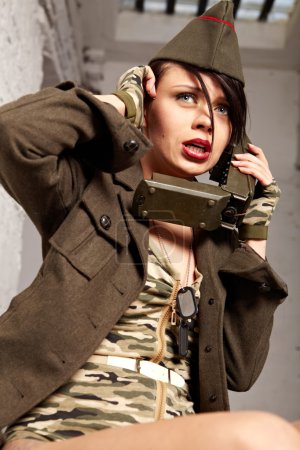 Beautiful girl in military clothes. studio shot