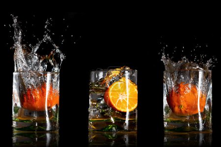 Splashing drinks with oranges