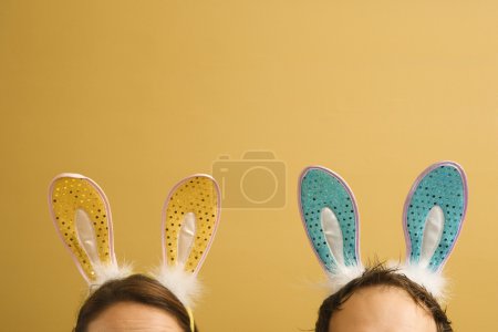 Couple wearing rabbit ears.