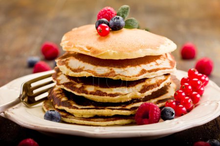 Pancakes on wooden table