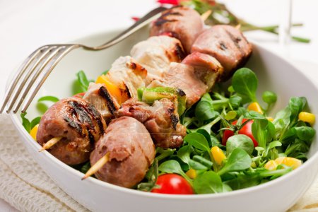 Meat Skewers on white table