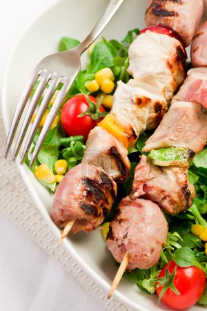 Meat Skewers on white table