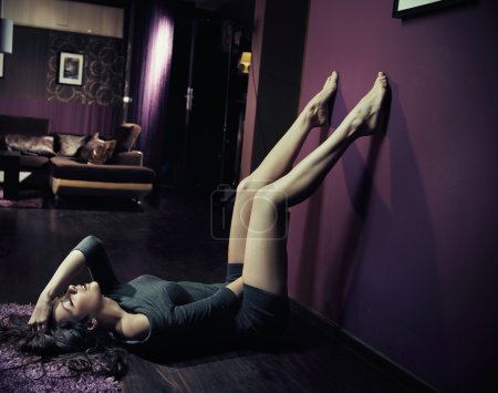 Nostalgic woman lying on a floor