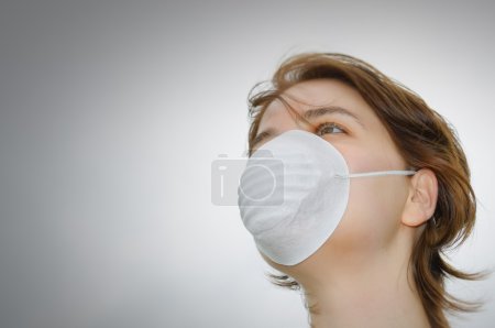 Woman with medical mask and copy space