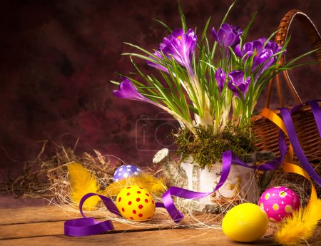 Art Easter background with crocuses and Easter eggs