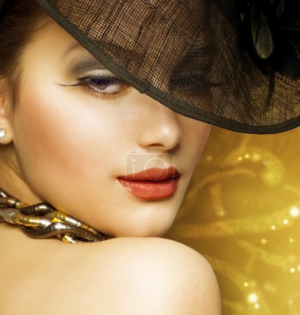 Fashion Beautiful Woman Over Luxury Gold background