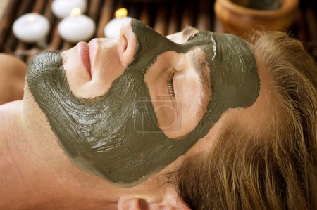 Spa. Handsome Man With A Mud Mask On His Face