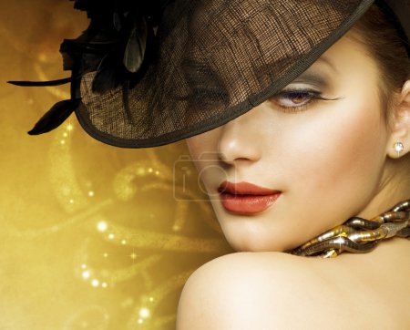 Fashion Beautiful Woman Over luxury Gold Background